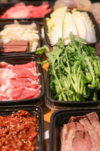 High angle view of hotpot raw ingredients on table