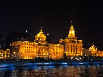 Illuminated buildings in city at night