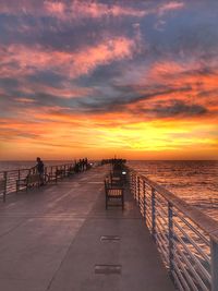 Scenic view of sea against orange sky