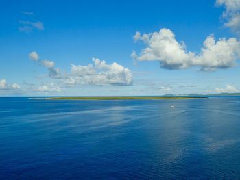 Scenic view of sea against blue sky