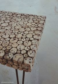 High angle view of wood on table against wall