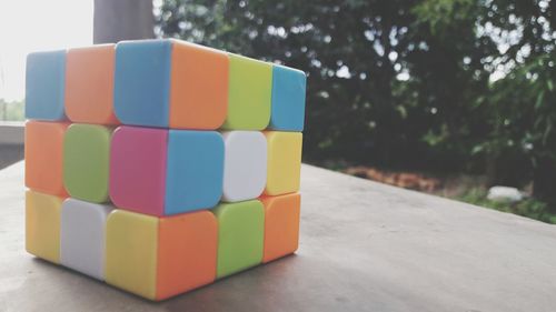 Close-up of multi colored stack against trees