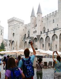 Tourists in front of historical building