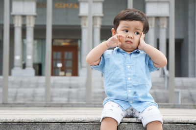 Portrait of cute boy looking away