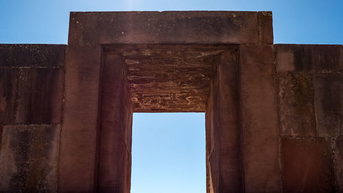 Low angle view of historical building against blue sky