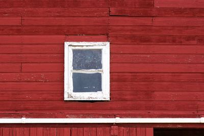 Full frame shot of window of red house