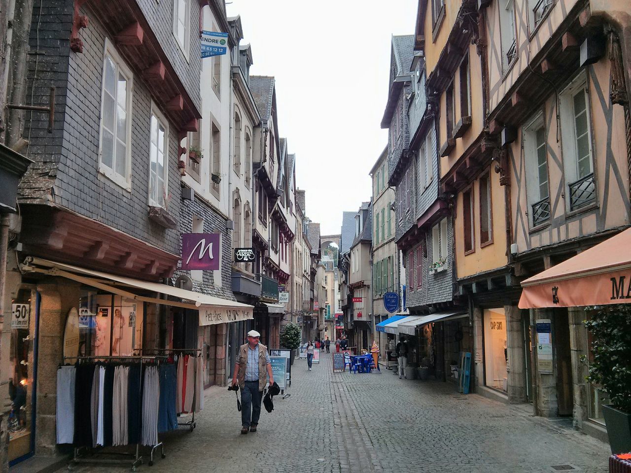 building exterior, architecture, built structure, street, residential building, the way forward, residential structure, city, transportation, building, alley, walking, city life, clear sky, road, men, car, incidental people, narrow