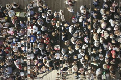 High angle view of people standing on street