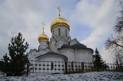 Low angle view of cathedral against sky during winter