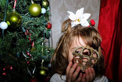 Close-up of girl holding christmas decoration