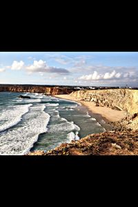 Scenic view of sea against cloudy sky