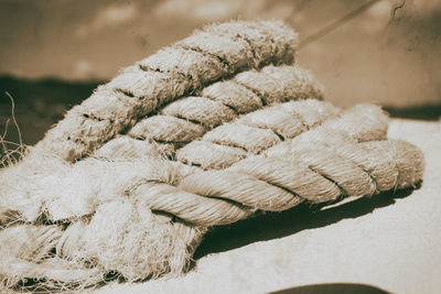 Close-up of rope tied to bollard