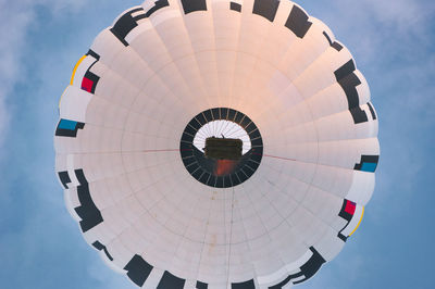 Low angle view of hot air balloon flying against sky