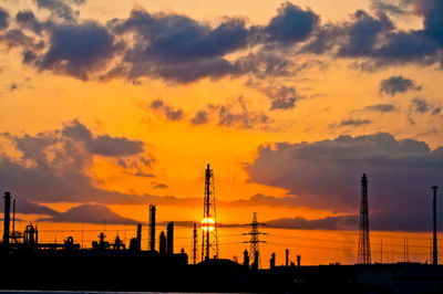 Low angle view of buildings against sky during sunset