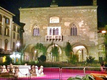 Facade of illuminated building at night