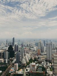 High angle view of modern buildings in city against sky