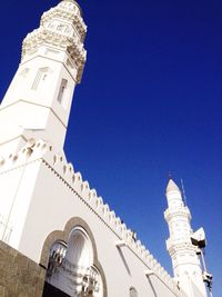 Low angle view of building against clear blue sky