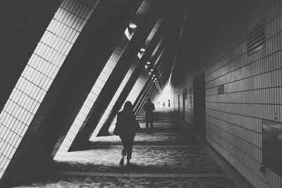 Full length of woman walking in corridor