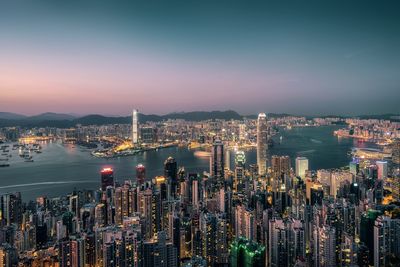 High angle view of city lit up at night