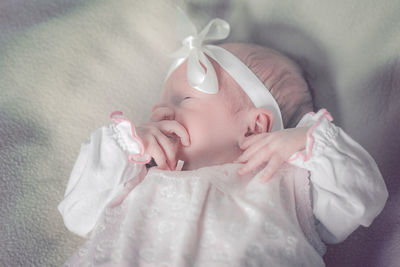 Cute baby sleeping on bed