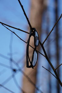 Low angle view of telephone pole against sky