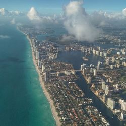 Aerial view of city by sea