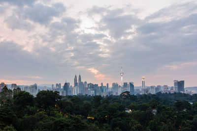 View of buildings against cloudy sky