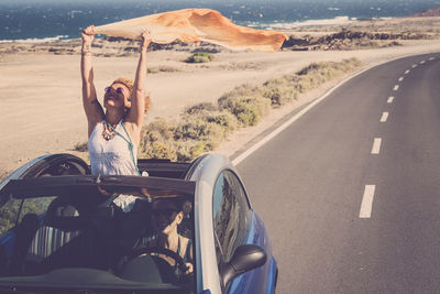 Portrait of woman on road