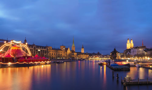 Illuminated city at waterfront