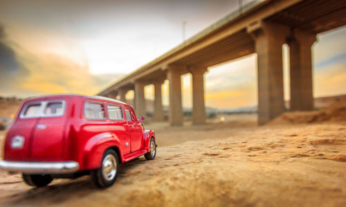 Red vintage car against sky