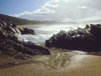 Scenic view of beach against sky