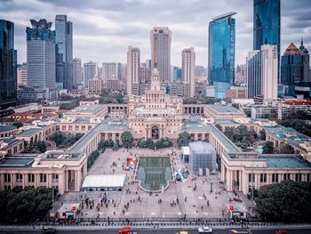 High angle view of shanghai exhibition centre against modern buildings