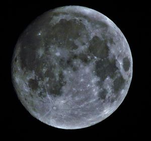 Low angle view of moon against sky at night