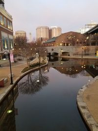 City at waterfront against sky