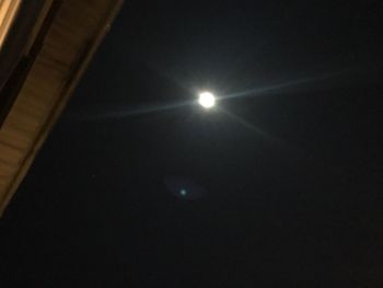 Low angle view of moon against sky at night