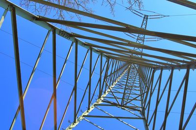 Low angle view of bridge against clear blue sky
