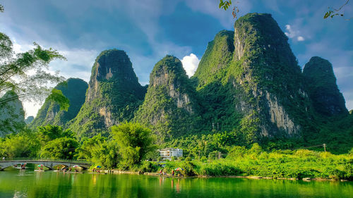 A small river against backdrop of the yellow mountains in china. tourist district