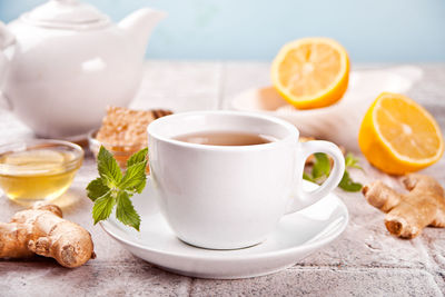 Refreshing ginger tea with lemon, mint leaf and honey