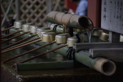 Bamboo dippers at drinking fountain