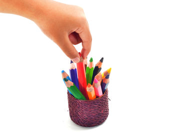 Close-up of multi colored pencils against white background