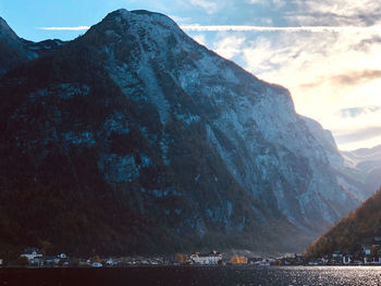 Scenic view of sea and mountains against sky