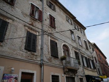 Low angle view of old building against sky