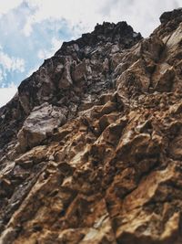 Low angle view of rock formation against sky