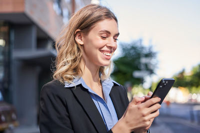 Young woman using mobile phone