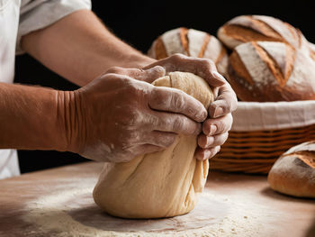 Cropped hand of person preparing food