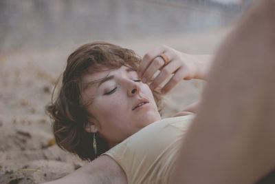 Woman with eyes closed at beach 