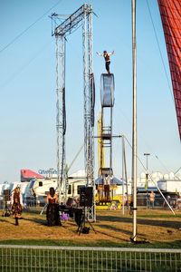 Man standing against clear blue sky