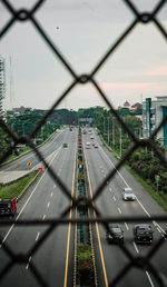 Aerial view of bridge in city against sky