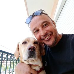 Portrait of smiling man with dog