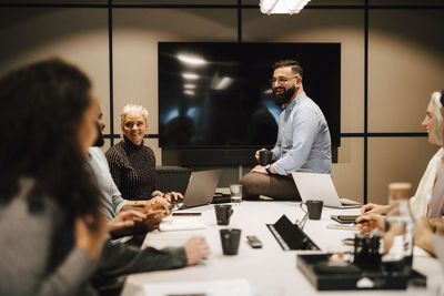 Coworkers having meeting in office